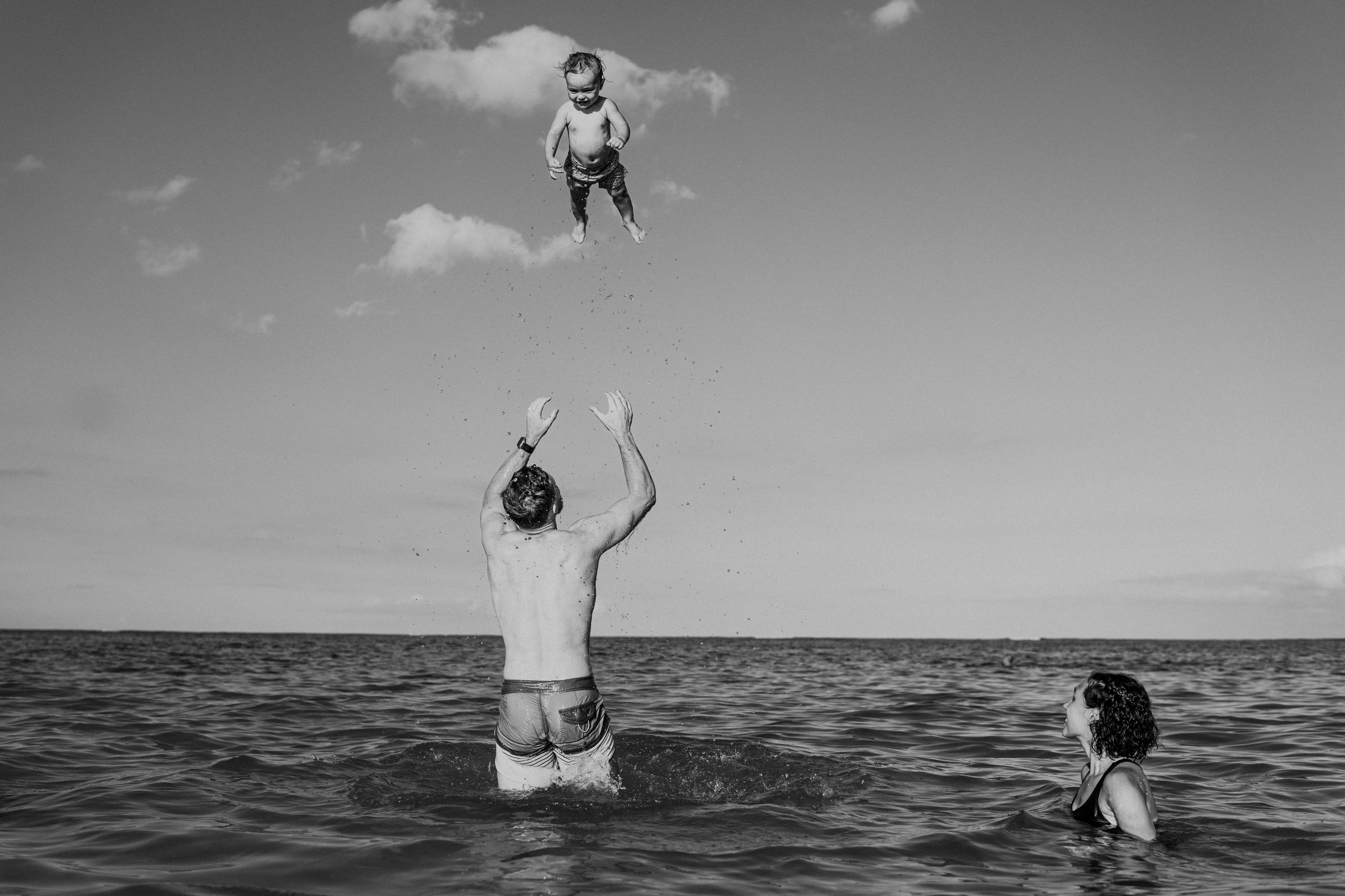 Father and child at the ocean — Tiora family archive
